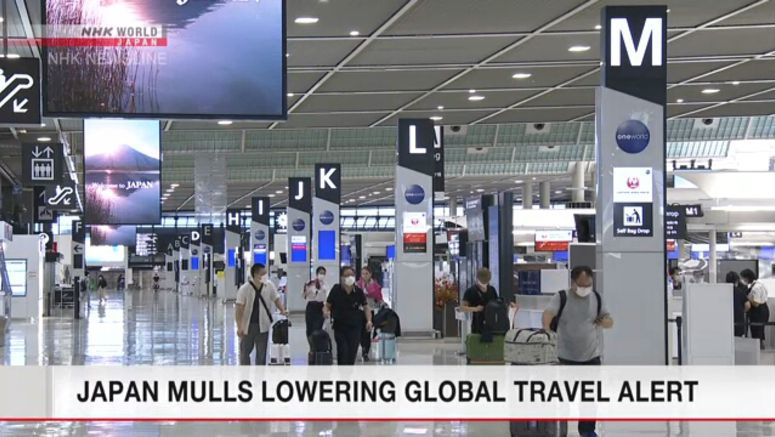 Japan mulls lowering global travel alert