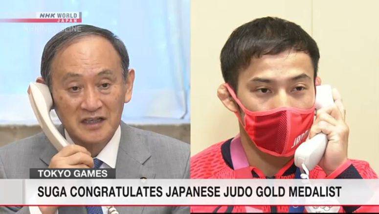 Suga congratulates Japanese judo gold medalist