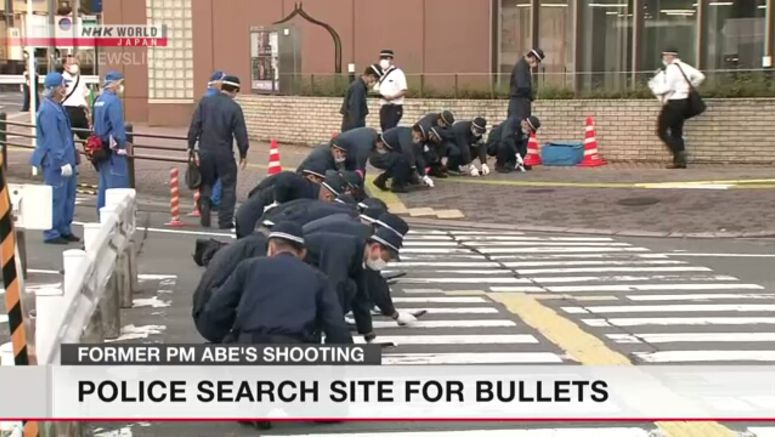 Investigators search site of Abe's shooting for bullets