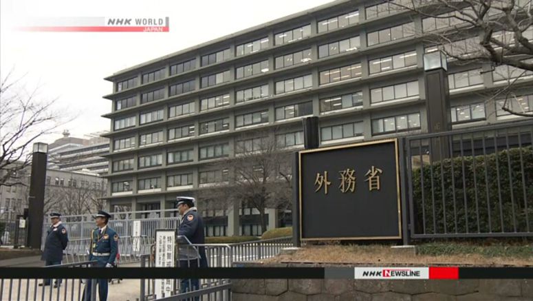 Japan lowers COVID-19 alert level for travel overseas