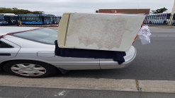 Aussie Tries To Carry Fridge On A Toyota Camry, Police Aren't Impressed