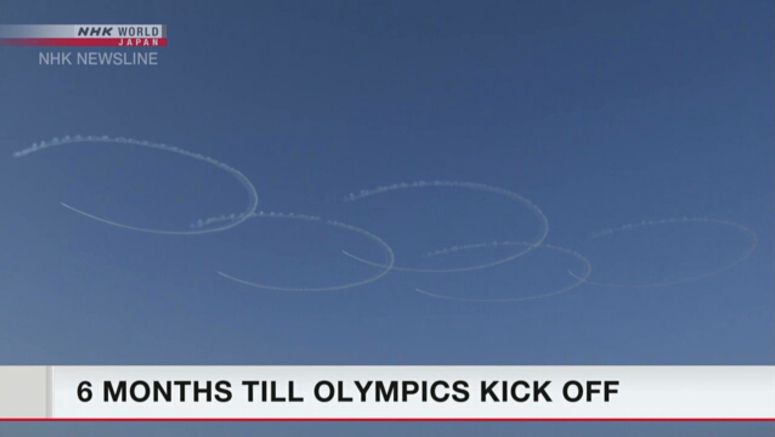 Air team practices skywriting Olympic rings